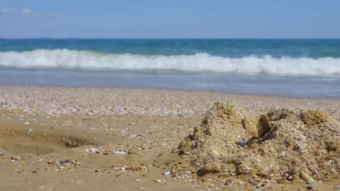 Seashore with waves gently washing over sand in 4k slow motion 120fps Stock Footage 266511294
