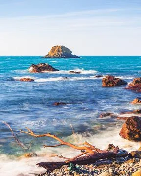 Seaside and rocks on the beach Stock Photos