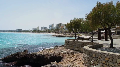 Seaside beach coastline of Cala Millor, Majorca Spain Mediterranean Sea Stock Footage 100680228