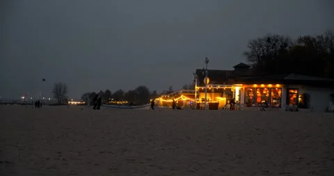 Seaside Beach with Restaurant in the Evening Stock Footage 297578422