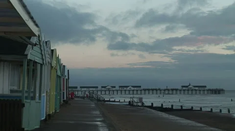 Seaside beech huts time lapse clouds moving Stockbeeldmateriaal 58460611