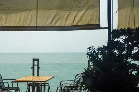 Seaside cafe window with quiet table Stock Photos