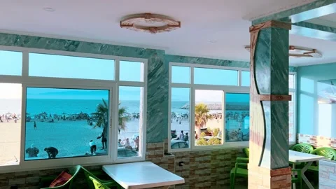 Seaside Café Window View Over Busy Beach, Northern Morocco Stock Footage 318594135