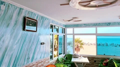Seaside Café Window View Over Busy Beach, Northern Morocco Video stock 318594136