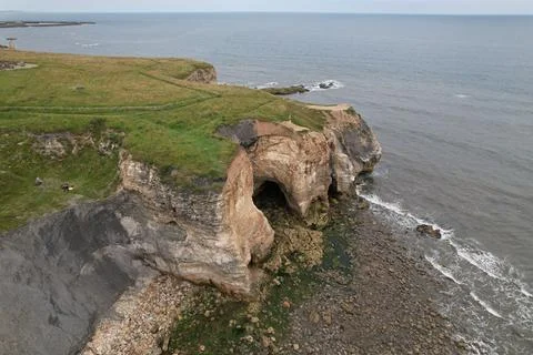Seaside of a Cliff, cave Stock Photos