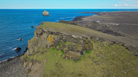 Seaside cliff formation with ocean backdrop, Dyrhólaey, Iceland. Stock Footage 315308927