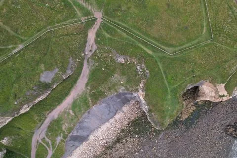 Seaside cliffs and walking paths on top of them Stock Photos