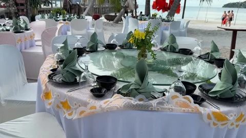 Seaside dinner table set up on the sandy shores of Koh Rong Sanloem Island Stock Footage 337082906