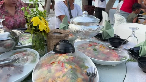 Seaside dinner table set up on the sandy shores of Koh Rong Sanloem Island Stock Footage 337083153