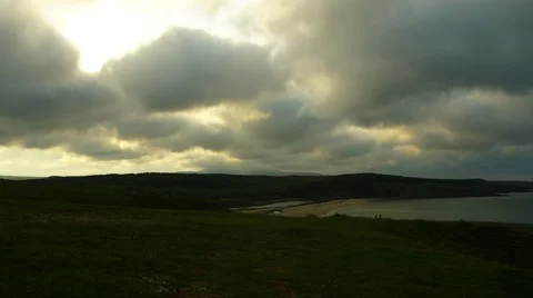 Seaside Dramatic Clouds and Sun Timelapse 4K Stock Footage 63557212