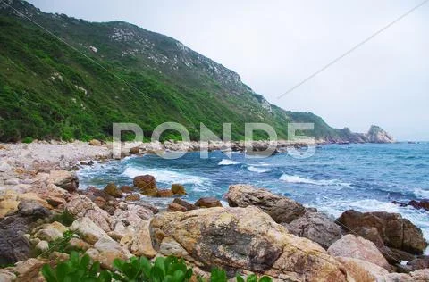 Seaside with great rocks at chinese city Hongkong Stock Photos