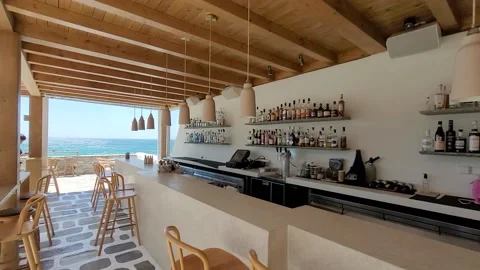 Seaside outdoor bar, bar stools, liquor shelves, mediterranean Video stock 169605342