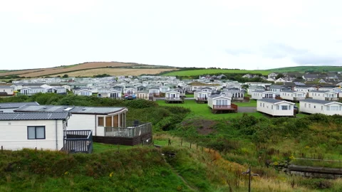 Seaside resort St. Bees caravan park pan at high sea tide. Vídeos de archivo 256294814