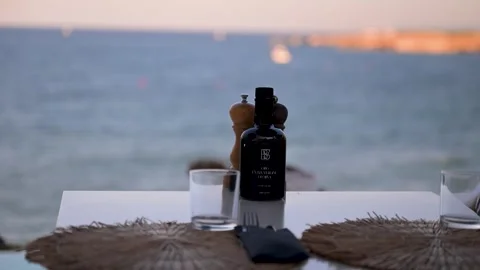 Seaside Restaurant Table Setting Overlooking Calm Water in Puglia Stock Footage 345310144