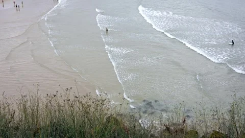 Seaside Serenity: High Tide at the Cliffside Beach Stock Footage 264349515