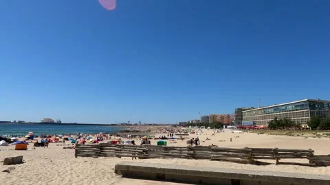 Seaside Spectacle A Packed Summer Beach in Porto, Portugal. Stock Footage 277270881
