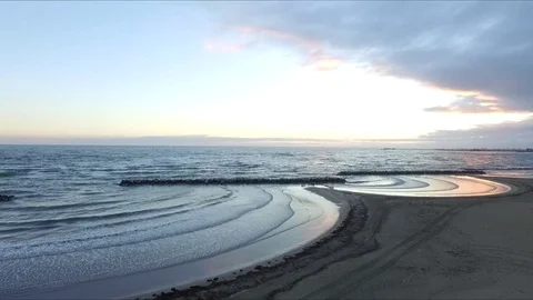 Seaside sunrise sea waves aerial Stock Footage