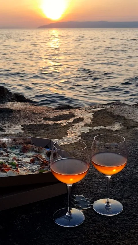 Seaside sunset picnic with pizza and rose wine. Stock Footage 339968356