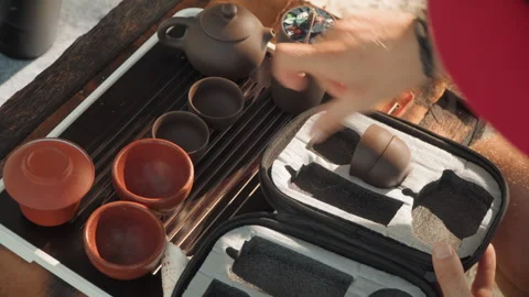 Seaside tea ritual. Relaxing beach tea experience. Intimate beachside tea Stock Footage 345178287