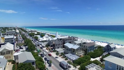 SEASIDE, USA 06/07/2019: Drone flying over town out to ocean Stock Footage