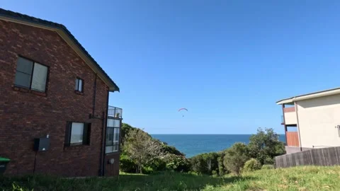 Seaside View with Paragliders Stock Footage 295989063