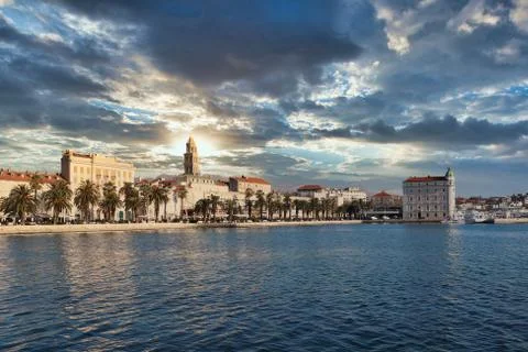 Seaside view of the town of Split, Croatia. Riviera with trees and the old to Stock Photos
