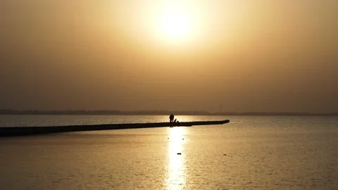 Seaside water surface sunset quiet romantic silhouette Baiguishan Reservoir Stock Footage 235568568