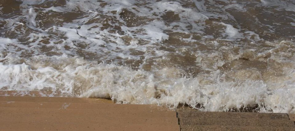 Seaside Waves Lapping on Steps Stock Photos