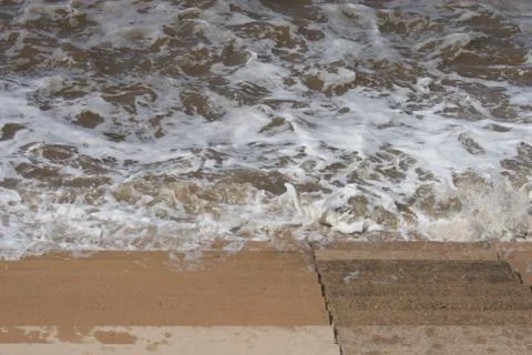 Seaside Waves Lapping on Steps Stock-Fotos