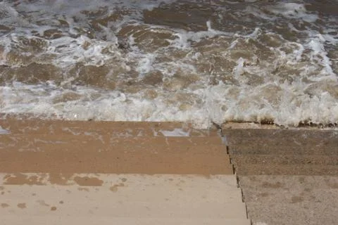 Seaside Waves Lapping on Steps 스톡 사진
