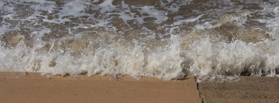 Seaside Waves Lapping on Steps Stock Photos