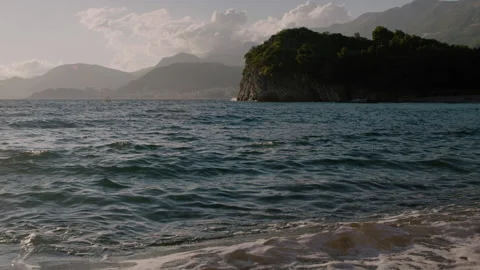 Seaside with waves at sunset in Montenegro Stock Footage 145357685
