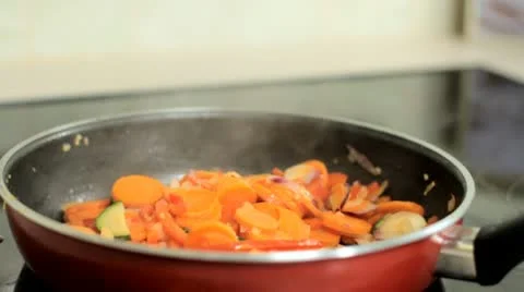 Season vegetables in the pan Stock Footage 12760736