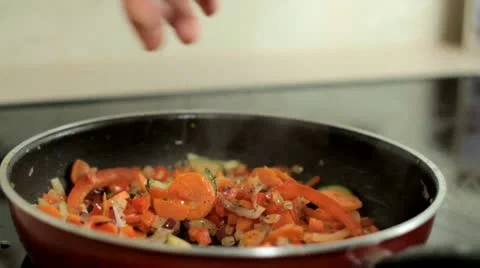 Season vegetables in the pan Stock Footage 12813800