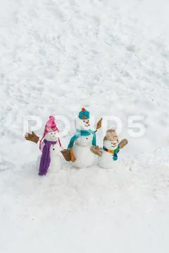 Seasonal Christmas holidays sale discounts. Happy Snowmen family. Holiday poster Stock Photos