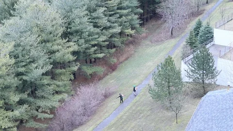Seasonal Grounds Crew Using Leaf Blower Aerial Footage 動画素材 127260503
