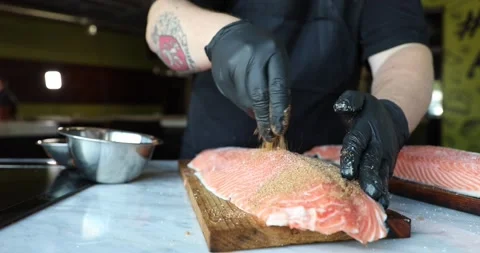 Seasoning a Fish Stock Footage 133816730