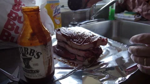 Seasoning steaks Stock Footage 68655858
