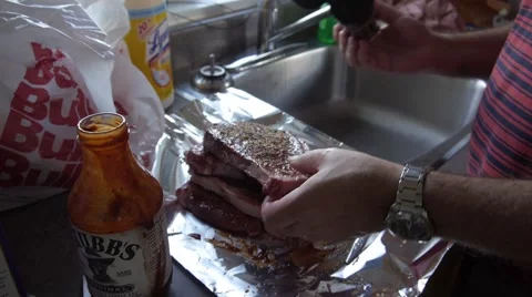 Seasoning steaks Stock Footage 68655901