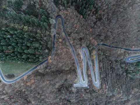 Seasons Concept winter or fall Aerial view Winding road serpentine mountain p Stock Photos