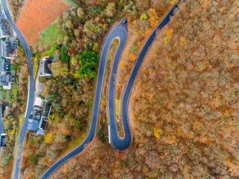 Seasons Concept winter or fall Aerial view Winding road serpentine mountain p Stock Photos