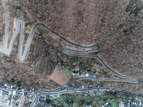 Seasons Concept winter or fall Aerial view Winding road serpentine mountain p Stock Photos