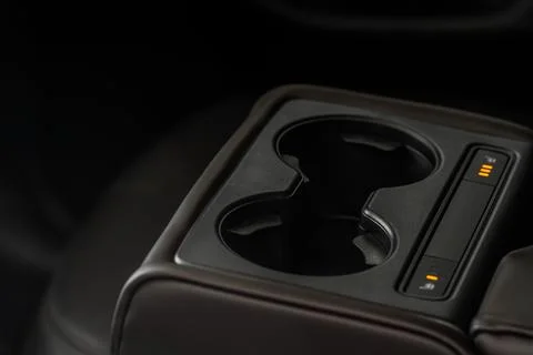 Seat heater button on the armrest, car interior. Stock Photos