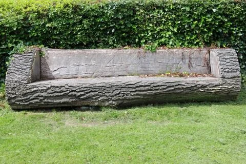 Seat made from a tree trunk Stock Photos