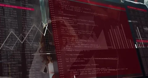 Seated analyst noting docs, standing peer pointing, starting red HUD code, Stock Footage 321701182