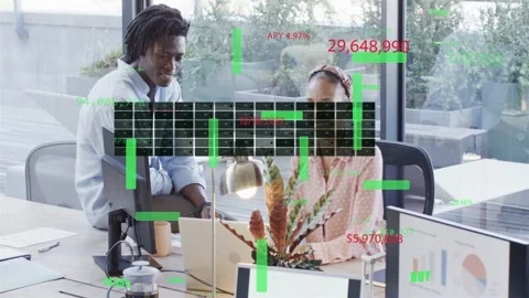 Seated analyst typing laptop, standing man leaning, animating business charts, Stock Footage 333594443