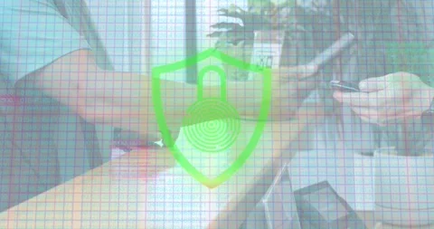 Seated coworker scanning QR code causing shield icon shifting for security login Stock Footage 317330227