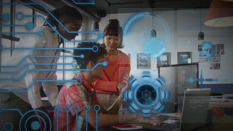 Seated dev typing and pointing, team leaning, reviewing tech project, blue HUD Stock Footage 331736296