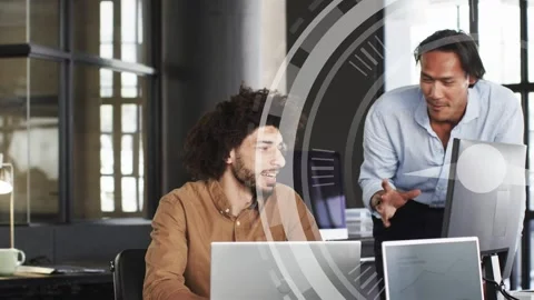 Seated dev typing, pointing, initiating translucent circular UI overlay tech Stock Footage 333975583