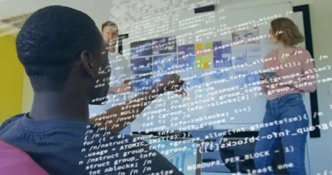 Seated developer pointing chart and generating code overlay as team analyzing Stock Footage 311216380